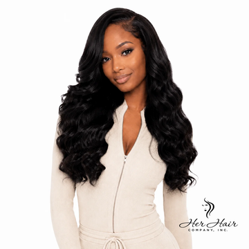 Burmese Raw Loose Deep Wave Hair 4 Bundle Deal from Her Hair Company, showing natural wavy hair bundles on a model.