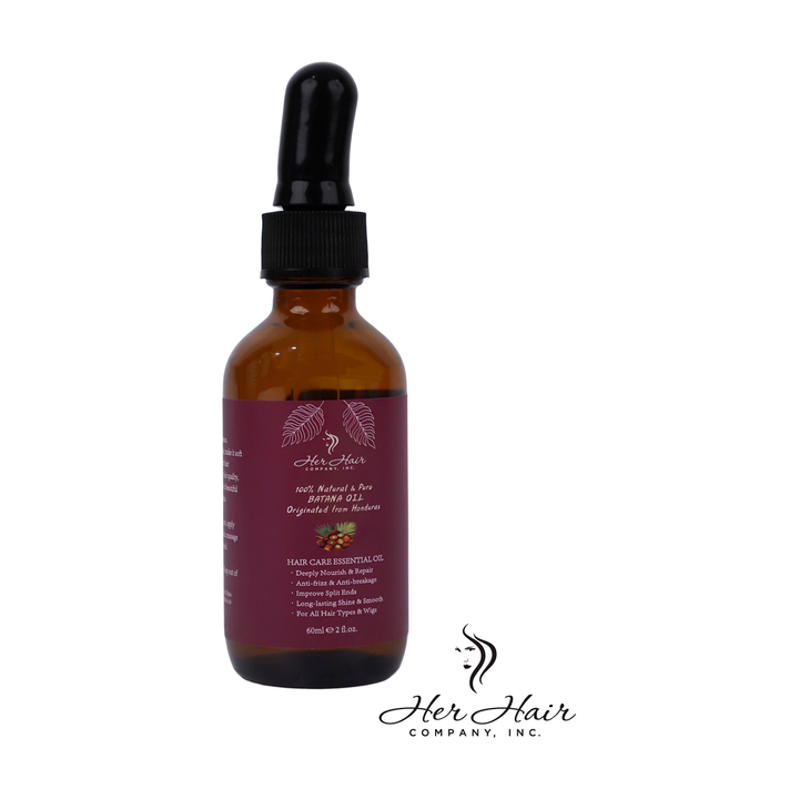Bottle of Her Hair Company Honduran Batana Oil, 100% natural and authentic, with a clear front label and dark glass bottle.