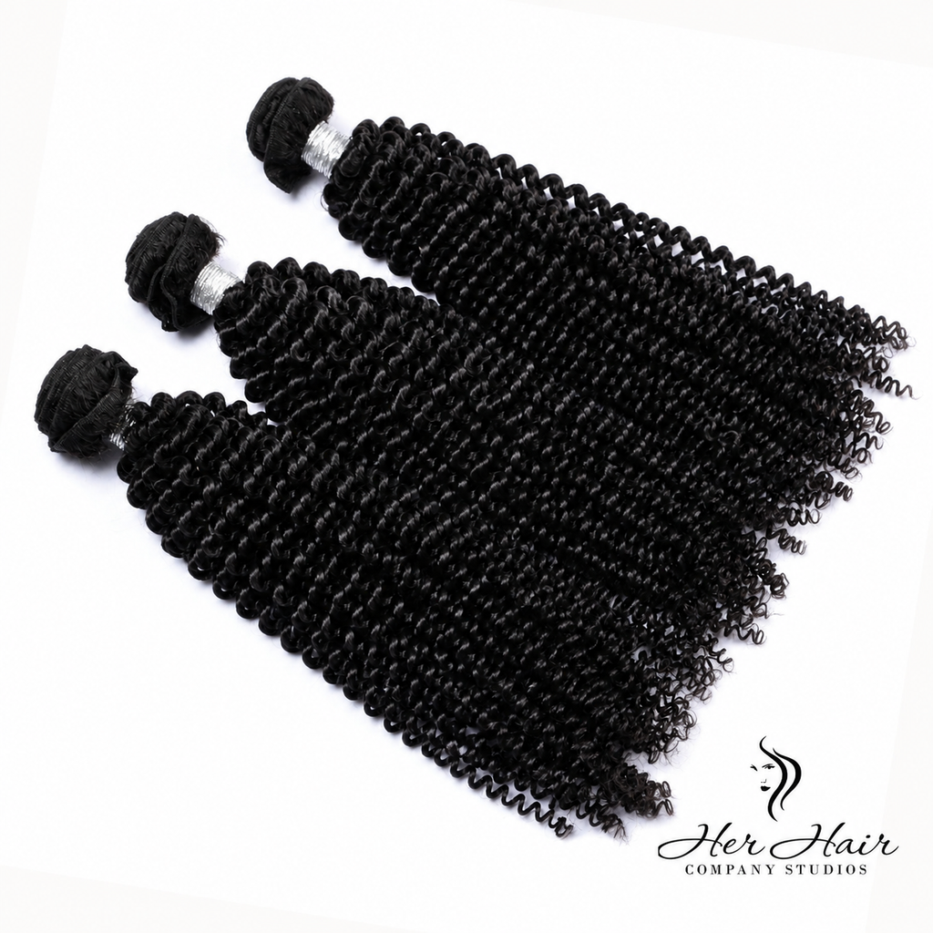 Three bundles of Brazilian kinky curly hair from Her Hair Company, showcasing full, textured curly hair bundles.