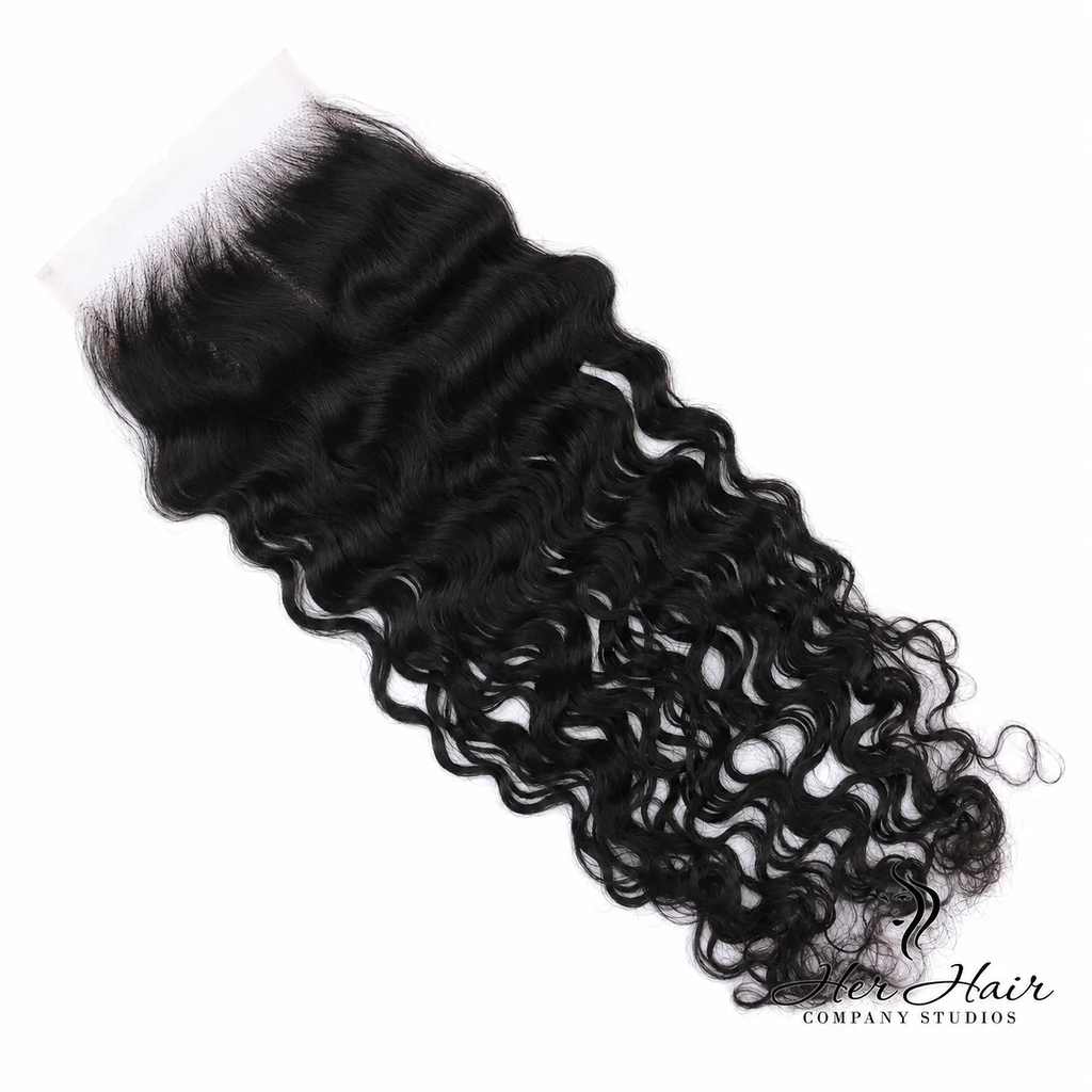 Brazilian raw wavy 5x5 HD lace closure from Her Hair Company, showcasing natural wavy texture and lace closure detail.