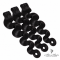 Three bundles of Burmese raw body wave hair from Her Hair Company, showcasing natural wavy hair extensions in standard bundle packaging.