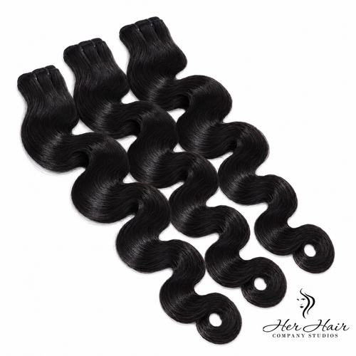 Three bundles of Burmese raw body wave hair from Her Hair Company, showing the natural wavy texture and full bundle packaging.