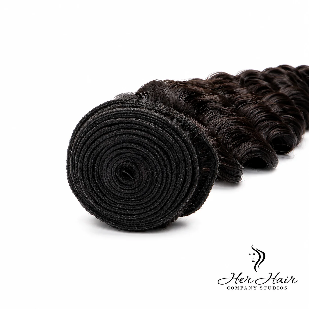 Close-up of Her Hair Company Brazilian Deep Wave hair weft showing the textured, deep wave pattern on a standard bundle.
