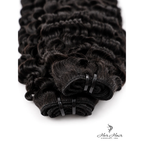 Burmese raw curly hair bundle from Her Hair Company, showing detailed view of the natural curly weft.