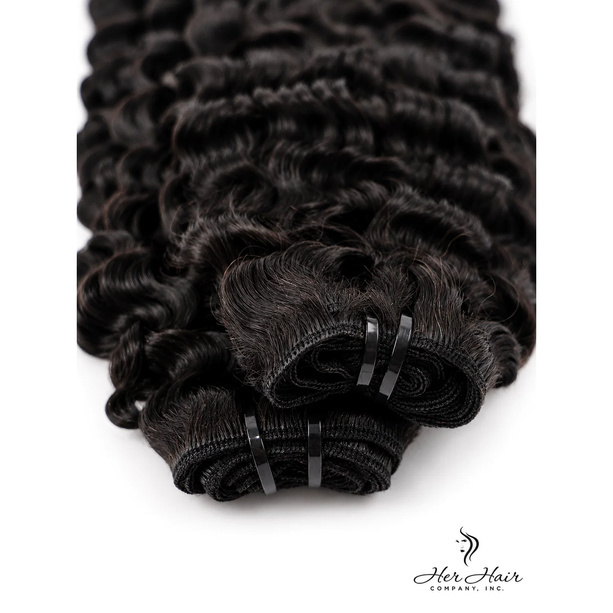 Burmese raw curly hair bundle from Her Hair Company, showing detailed close-up of the textured weft.