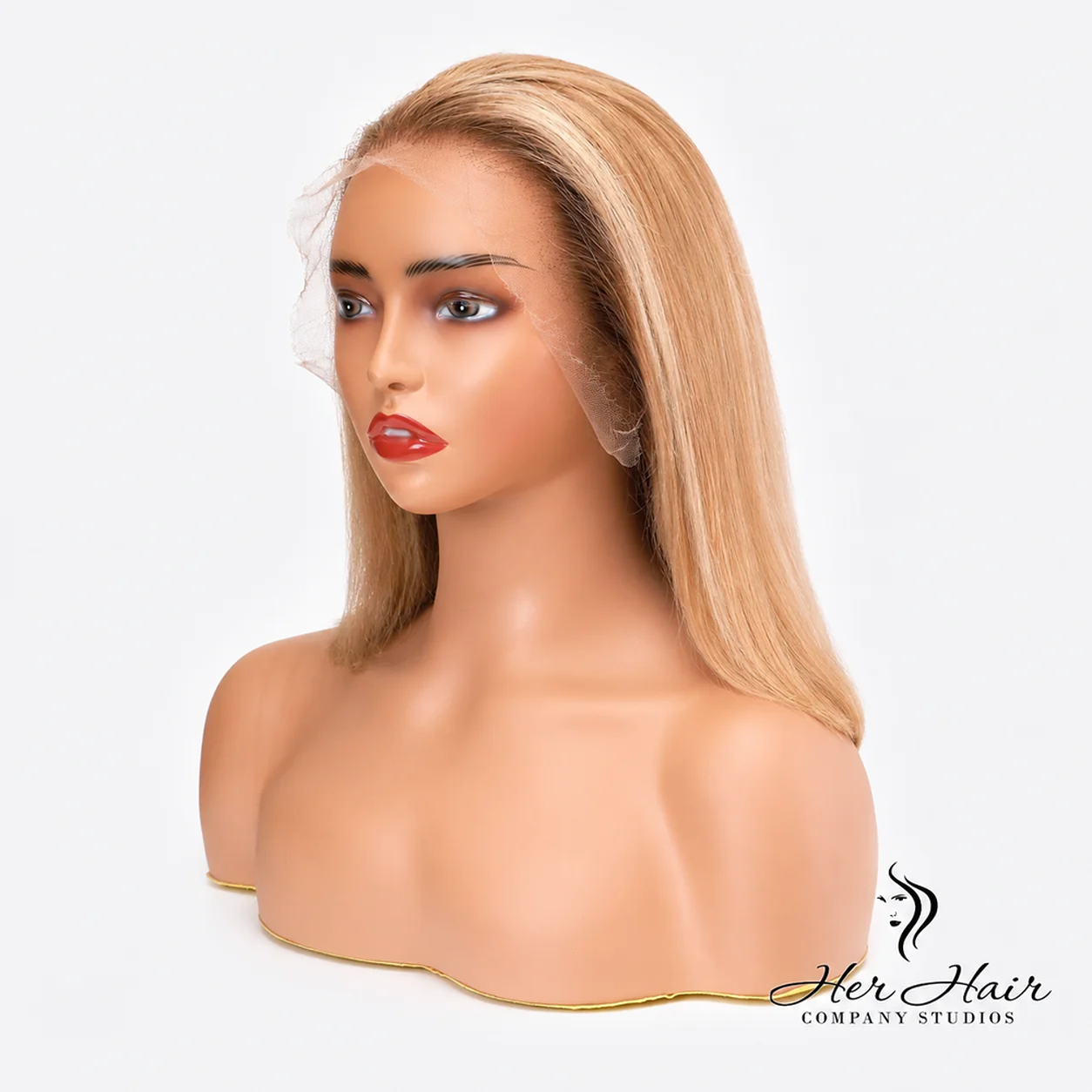 Honey blonde Swiss HD bob unit wig with natural hairline front, styled for a sleek, modern look by Her Hair Company.