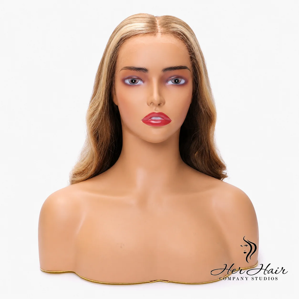 Honey blonde Swiss HD lace wig with natural hairline and soft waves, styled by Her Hair Company.