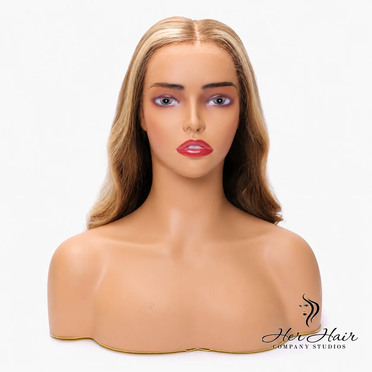 Honey blonde Swiss HD lace wig with natural hairline and soft waves, styled by Her Hair Company.