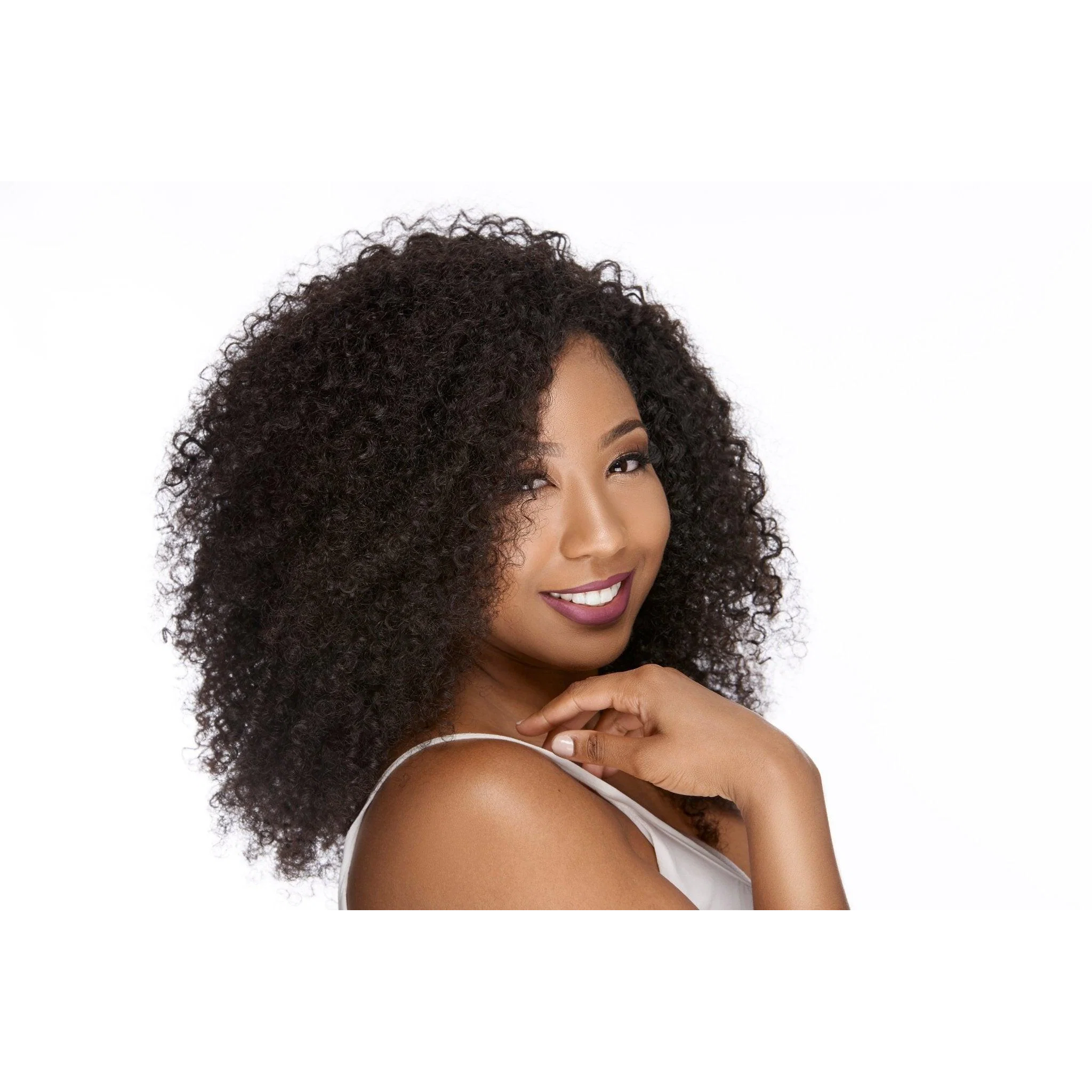 Angled view of a model wearing Brazilian Deep Curly Hair, showing dense curls, side profile, and natural-looking volume.