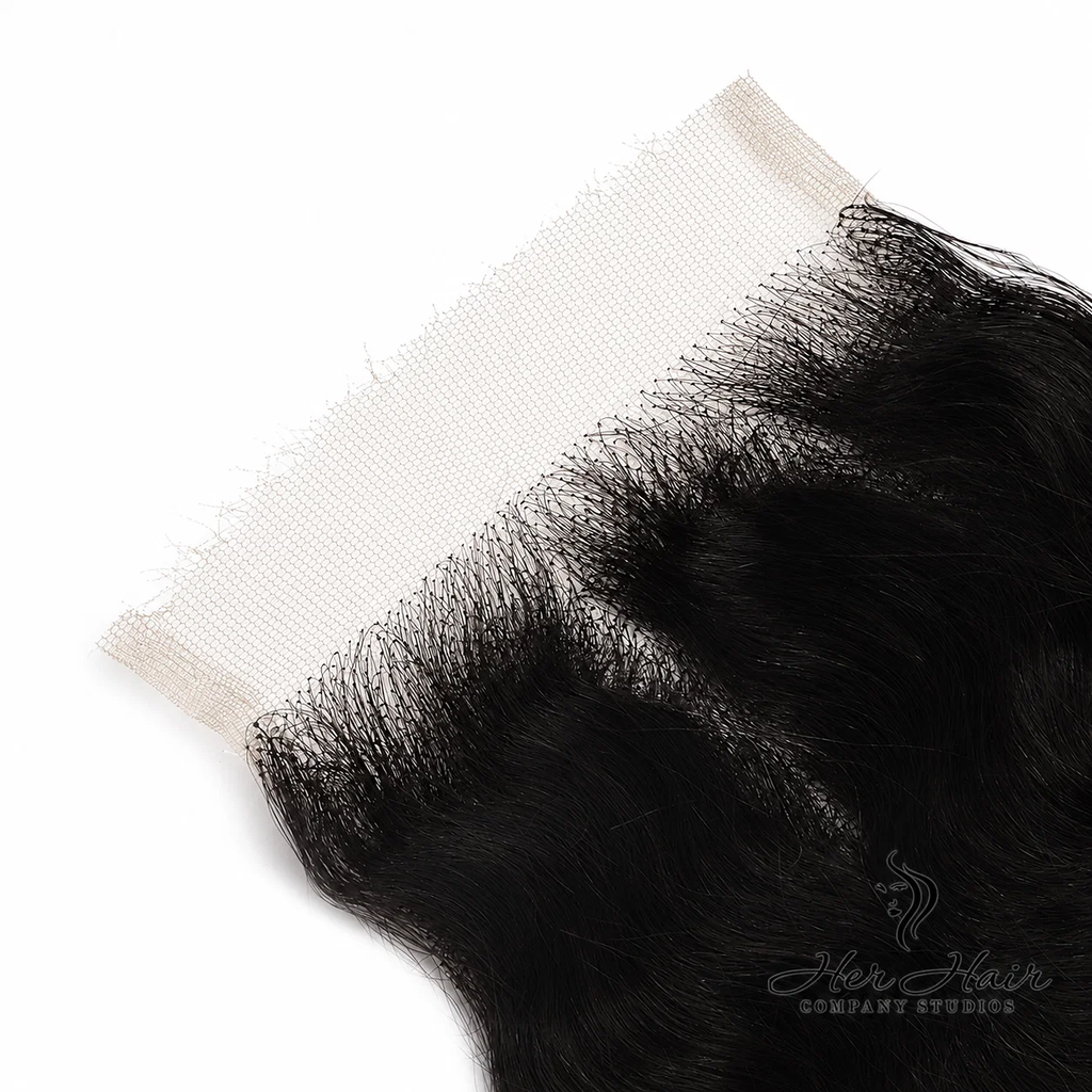 Close-up of Her Hair Company Brazilian Deep Wave 5x5 HD lace closure showing detailed hairline and deep wave texture.