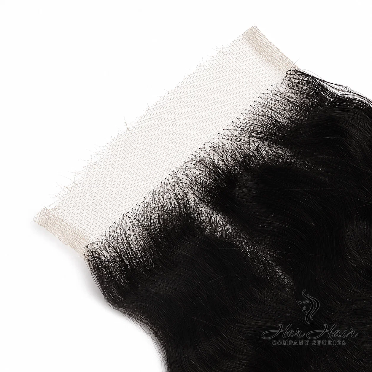 Close-up of Her Hair Company Brazilian Deep Wave 5x5 HD lace closure showing detailed hairline and deep wave texture.
