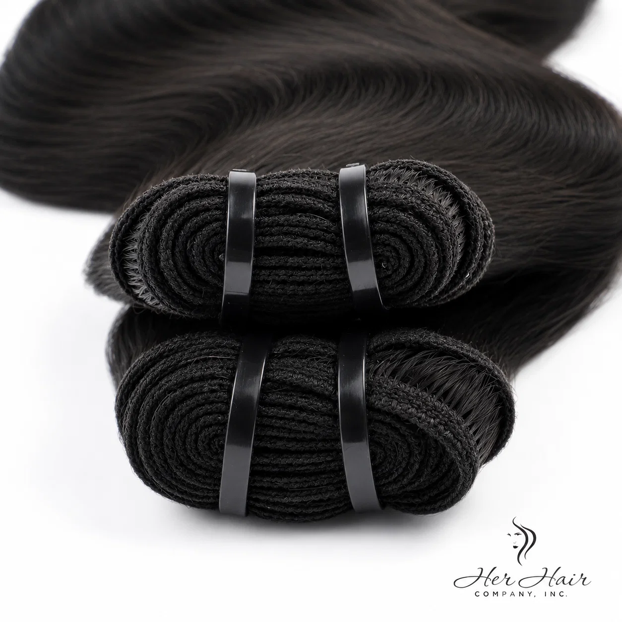 Close-up of Brazilian Double Drawn Hair wefts from Her Hair Company, showing the thick, even hair bundles in a standard bundle deal.