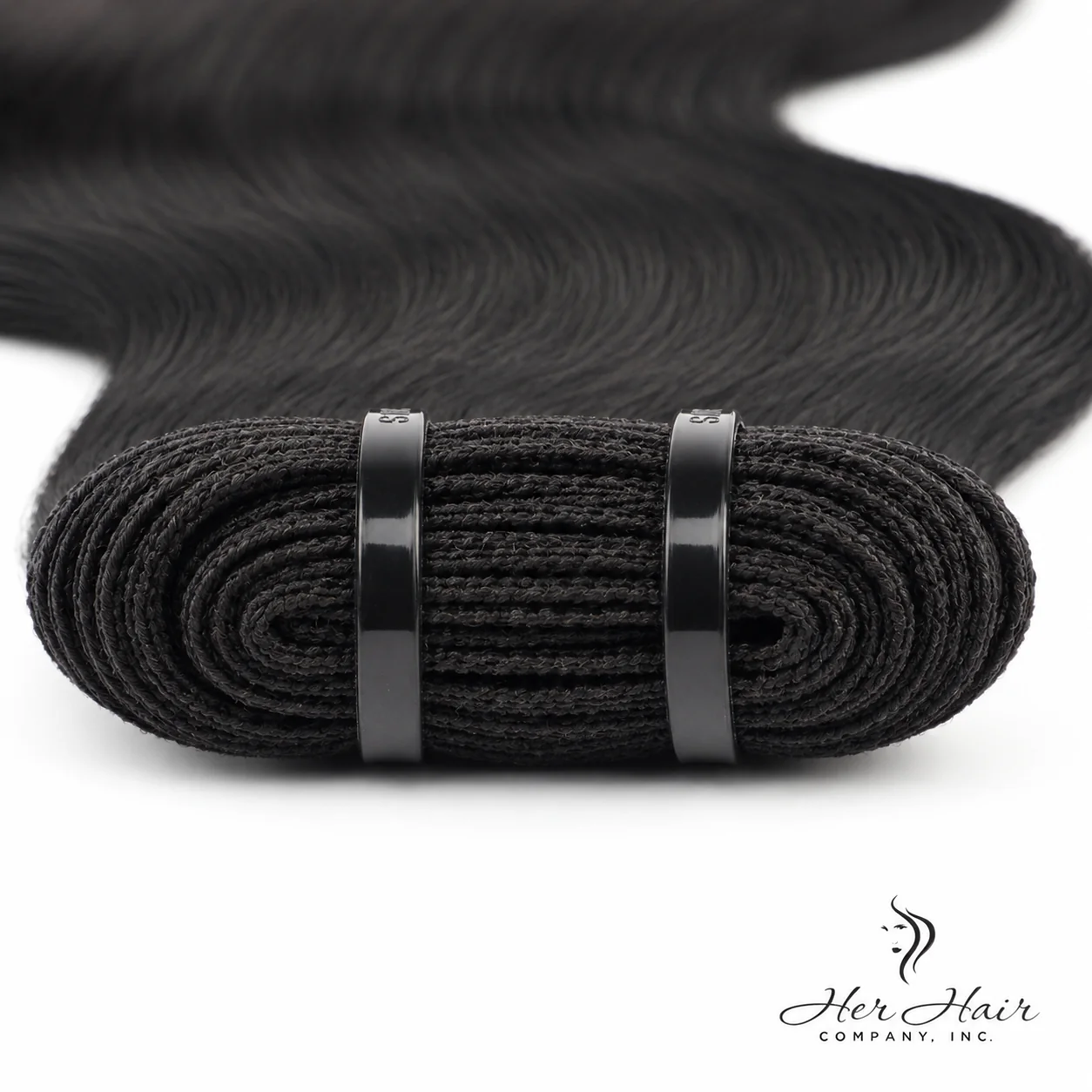 Close-up of Her Hair Company Brazilian Double Drawn Hair bundle with weft details, showing thick, uniform double-drawn hair strands.