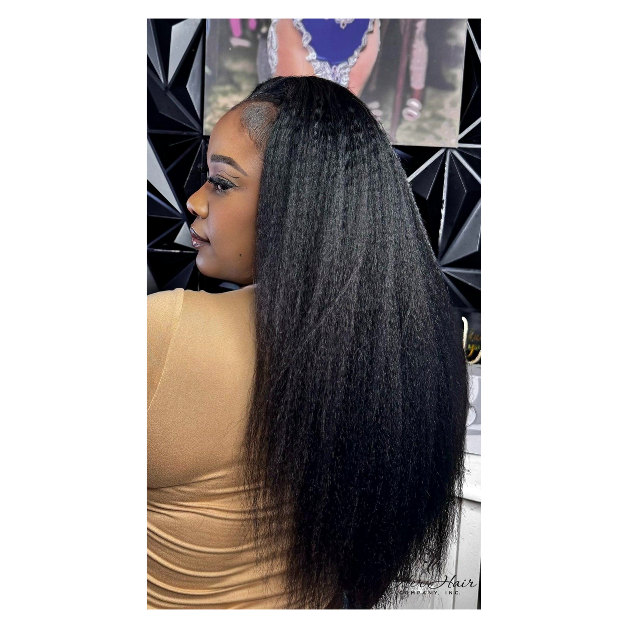 Brazilian kinky straight hair bundles from Her Hair Company, showing a customer installation with four bundles styled back.