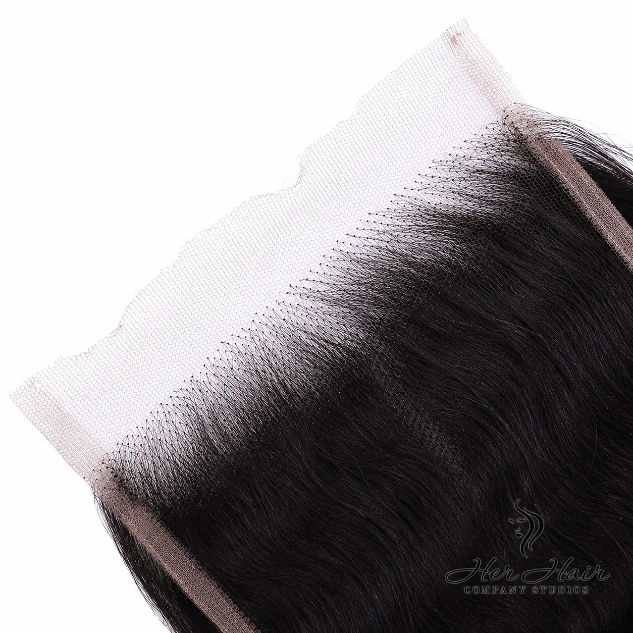 Close-up of Her Hair Company Brazilian Raw Wavy 5x5 HD lace closure showing detailed lace texture and natural wave pattern.