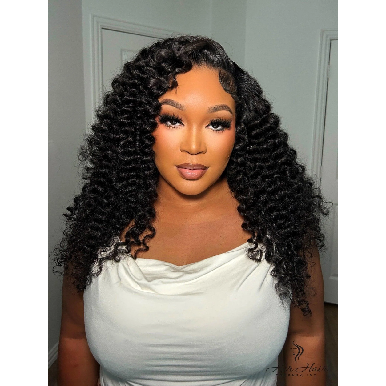Brazilian Water Wave hair extensions by Her Hair Company, three bundle deal, front view of installed natural-looking water wave style.