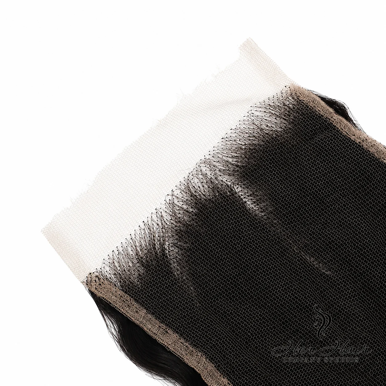 Close-up of Her Hair Company Brazilian Deep Wave 4x4 HD lace closure showing lace base detail and deep wave texture.