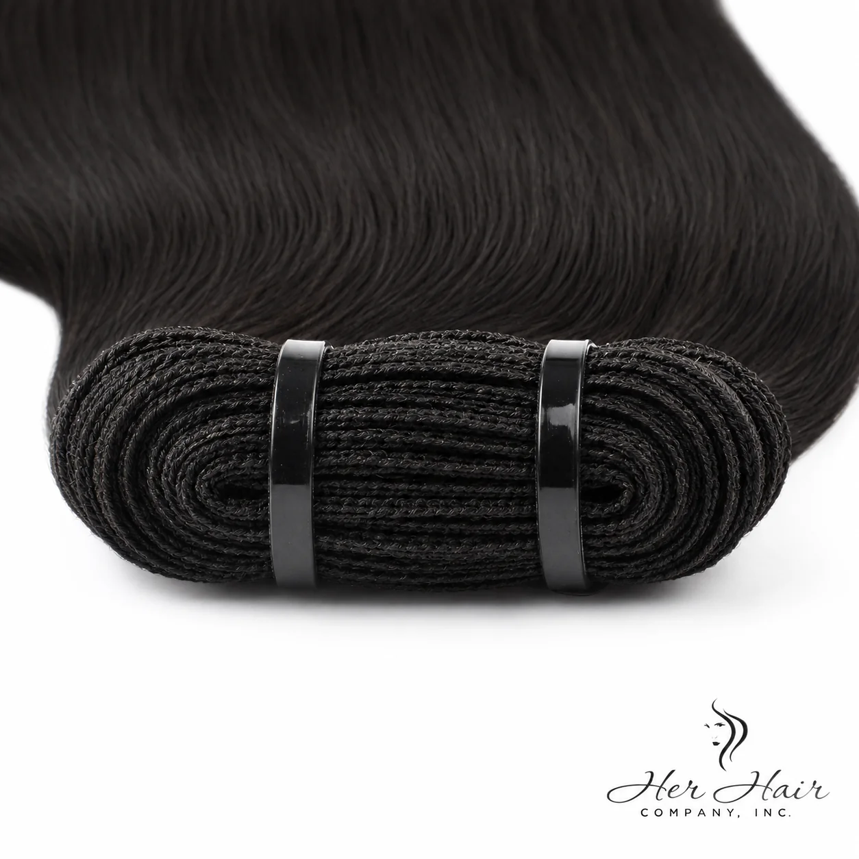Close-up of Her Hair Company Brazilian Double Drawn Hair bundle showing the thick, even weft and smooth, natural-looking hair strands.
