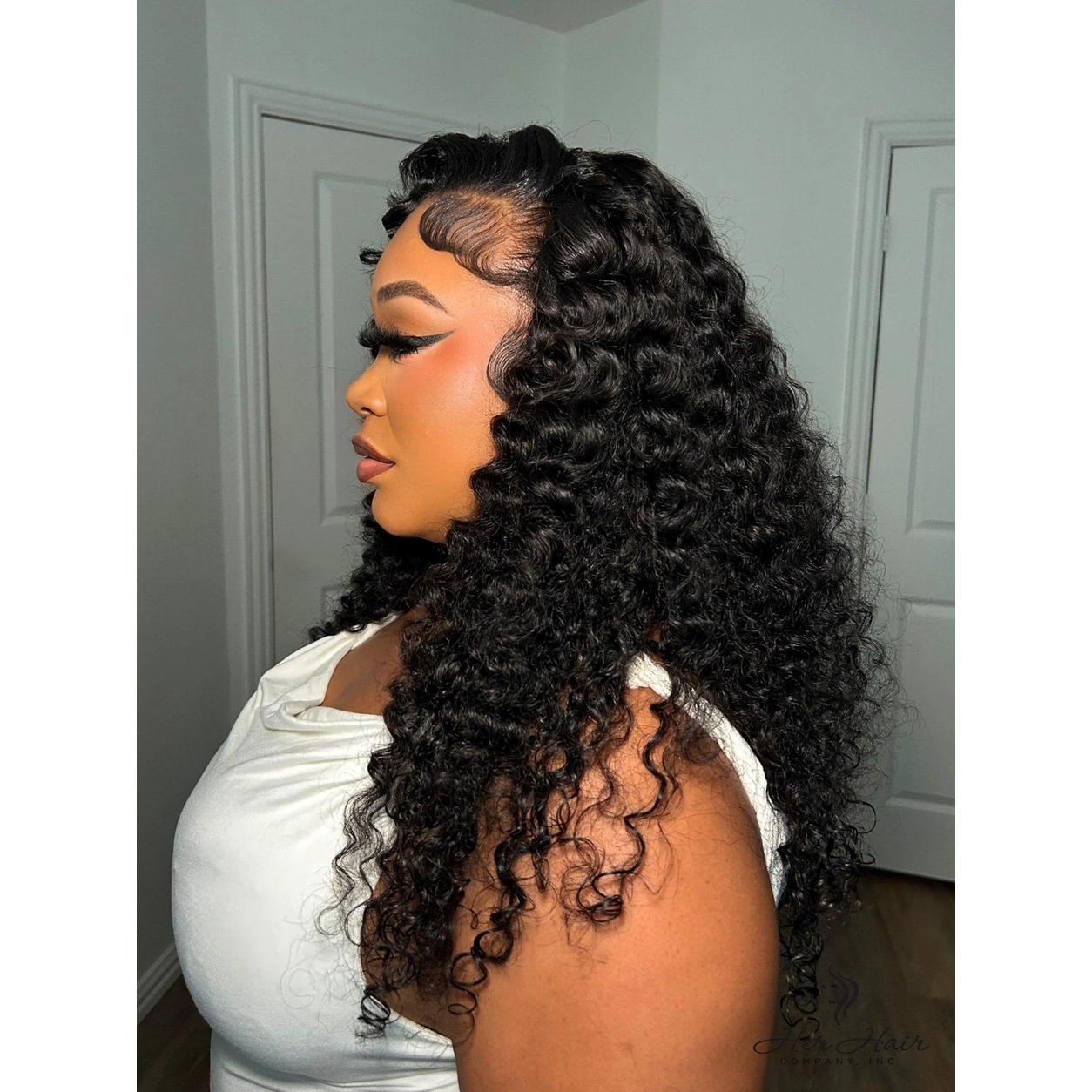 Her Hair Company Brazilian Water Wave hair bundles shown from the side, featuring soft, wavy hair texture and natural shine.