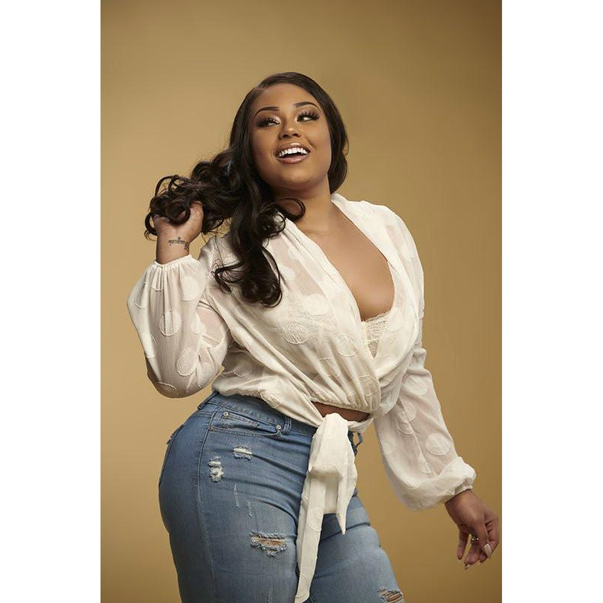 Brazilian loose deep wave 5x5 HD lace closure from Her Hair Company, styled on a model showcasing natural waves and detailed lace closure.