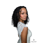 Side view of shoulder-length deep curly bulk hair bundle by Her Hair Company, showcasing lush, voluminous curls.