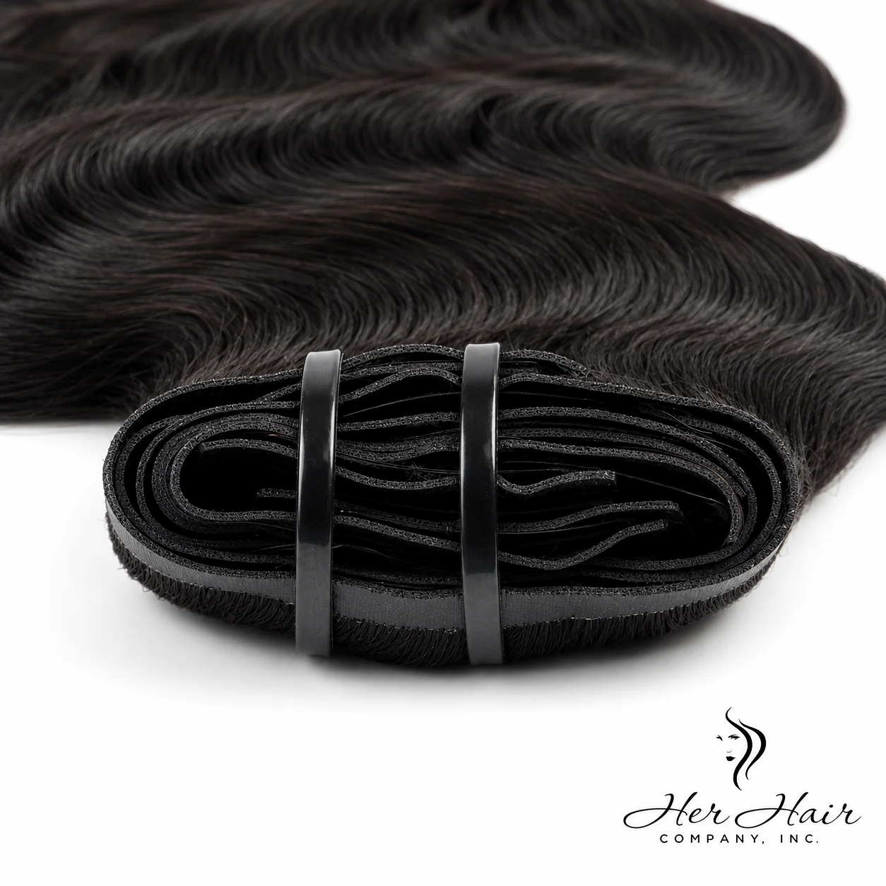 Brazilian clip-in hair extensions in a standard bundle with body wave texture, showcasing the weft details and natural hair appearance.
