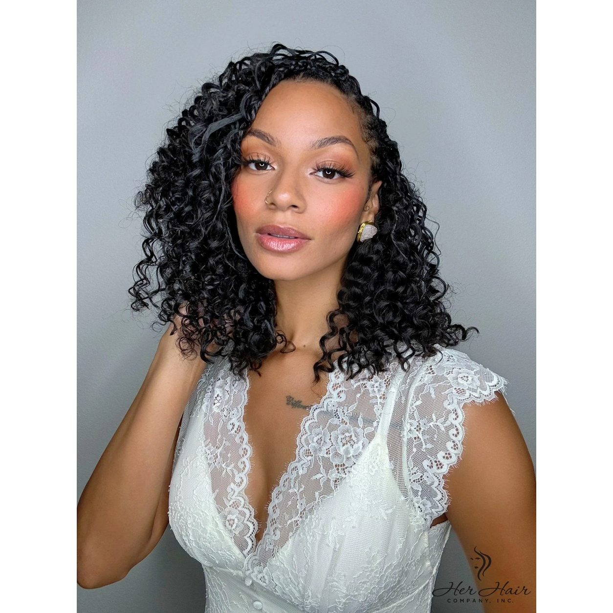 Close-up of shoulder-length deep curly bulk hair from Her Hair Company, showcasing its rich, voluminous curls in a standard bundle.
