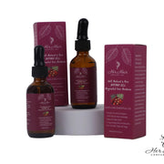 Honduran Batana Oil bottle from Her Hair Company, 100% natural and authentic, with a dark glass container and label.