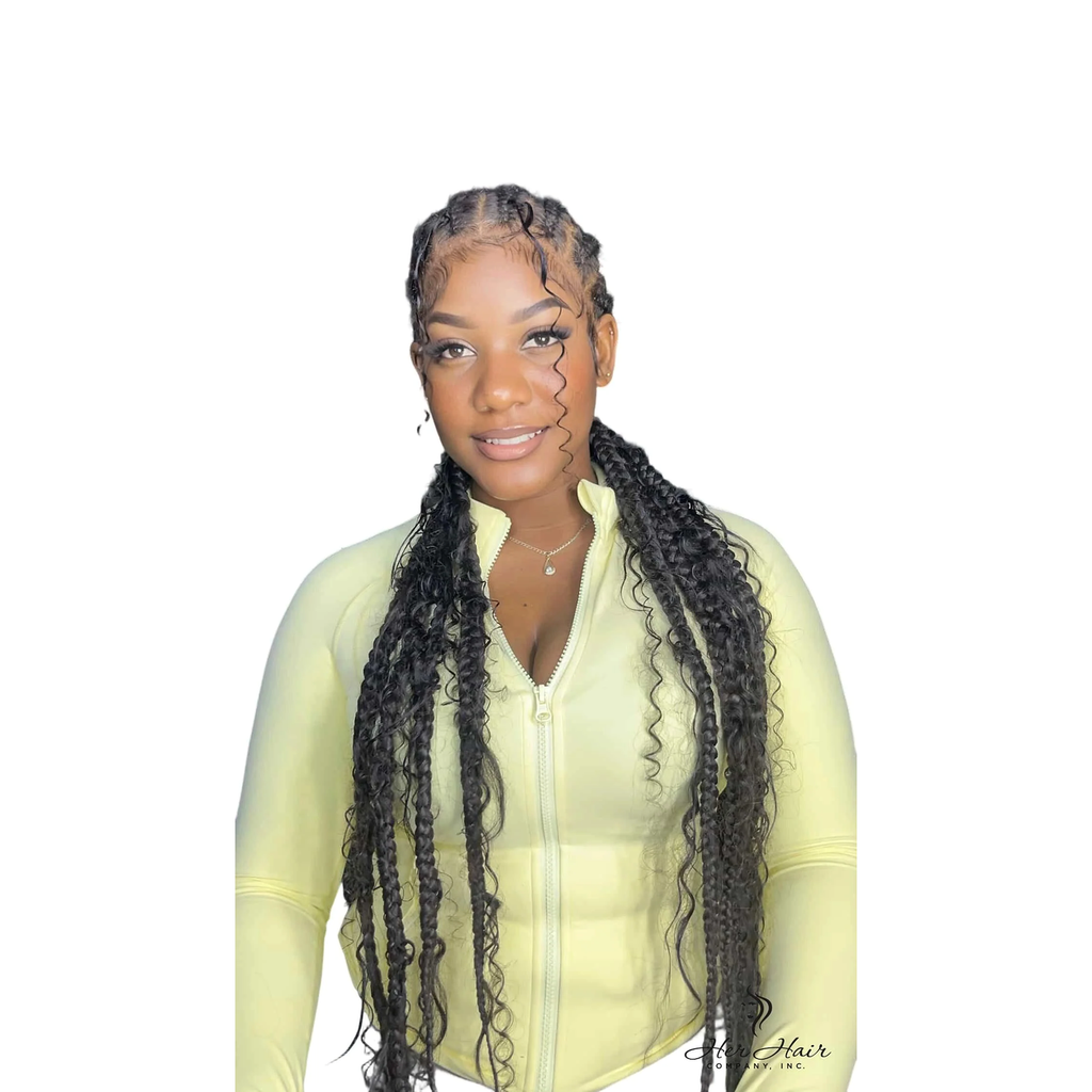 Deep curly bulk hair from Her Hair Company in a standard bundle, styled in a boho braid with green accents.