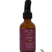 Honduran Batana Oil bottle from Her Hair Company, 100% natural and authentic, with a clear label and dark glass container.
