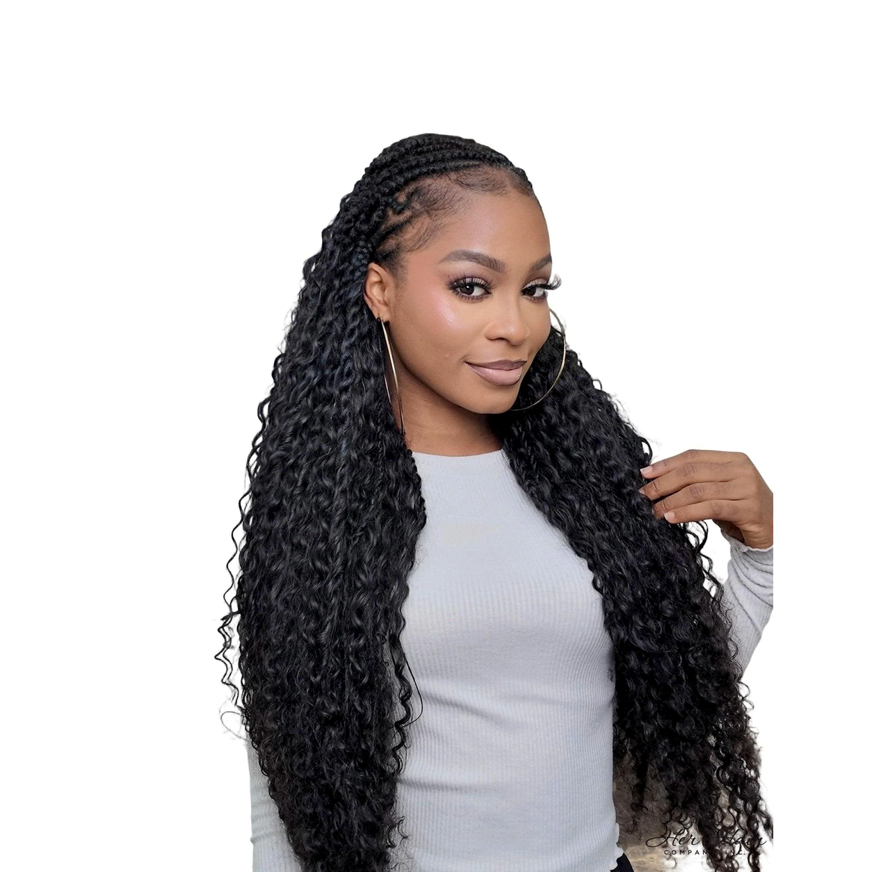 Deep curly bulk hair from Her Hair Company in a long braided style, showcasing the textured, voluminous curl pattern.
