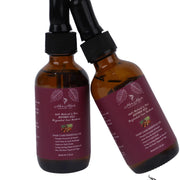 Honduran Batana Oil from Her Hair Company, natural and authentic, shown in a clear bottle with a wooden cap.