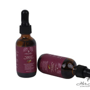 Honduran Batana Oil bottle from Her Hair Company, 100% natural and authentic, with a clear label and dark glass container.