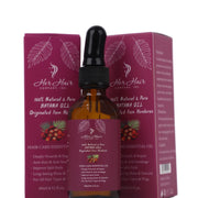 Bottle of Her Hair Company Honduran Batana Oil, 100% natural and authentic, with a clear label and dark glass packaging.