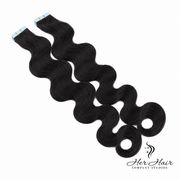 Straight Brazilian Tape-In hair extensions by Her Hair Company, shown in natural black, with sleek, seamless application.