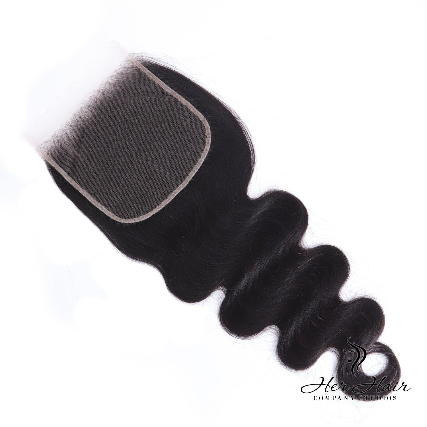 Brazilian Body Wave 6x6 HD lace closure from Her Hair Company showing natural wave pattern and detailed lace craftsmanship.