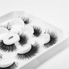 Her Hair Company false eyelashes with natural-looking, full-length lash extensions on a white background.