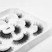 Her Hair Company eyelash extensions featuring full, natural-looking false eyelashes with a sleek design.