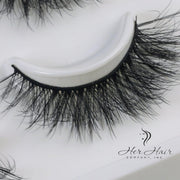 Her Hair Company eyelash extensions with natural, full lash look, showcasing the lightweight, wispy false eyelashes.