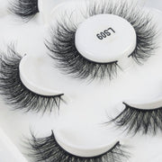 Her Hair Company eyelash extensions with full, natural-looking lash design on a white background