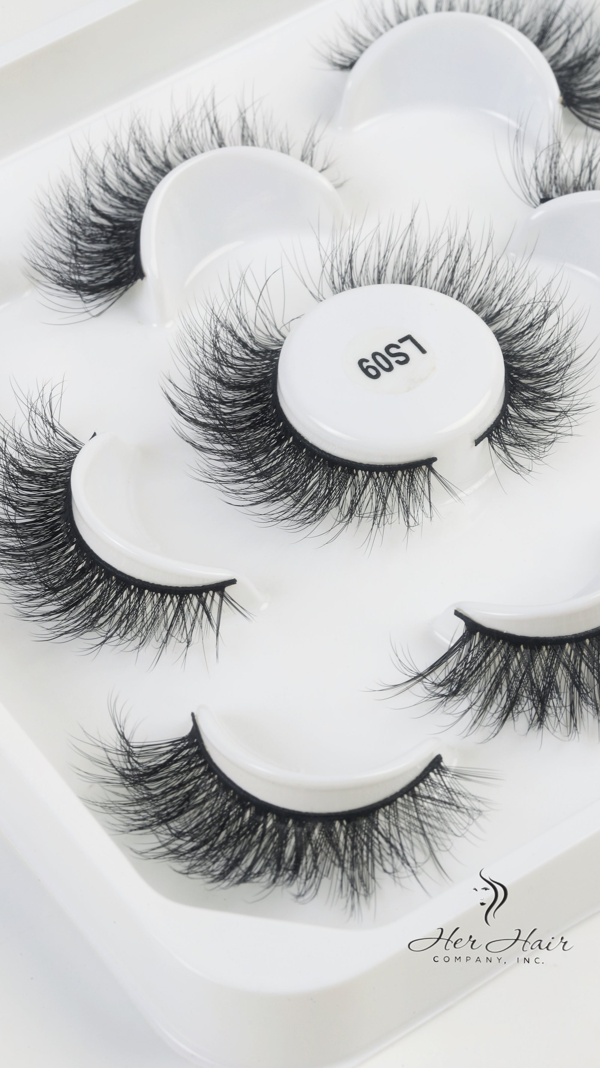 Her Hair Company false eyelashes with natural-looking, full lash design for enhanced eye beauty.