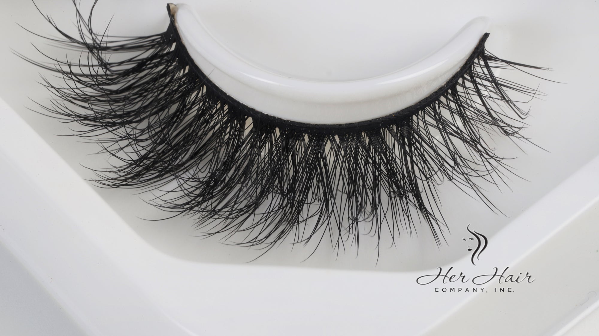 Her Hair Company false eyelashes, close-up view showing individual lash strands and natural lash style for a full, dramatic look.