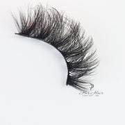 Her Hair Company false eyelashes with natural black design, showcasing full, voluminous lash style for a glamorous look.