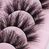 Her Hair Company false eyelashes showcasing long, voluminous black lash extensions with a natural curl.