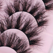Her Hair Company false eyelashes with natural-looking lash extensions, detailed close-up of individual synthetic lash fibers.