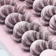 Her Hair Company false eyelashes with natural-looking lash extensions, shown in close-up on a white background.