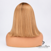 Honey blonde Swiss HD bob wig with dark roots from Her Hair Company, showcasing straight, sleek hair with a natural shine.