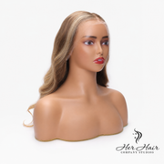 Honey blonde Swiss HD lace wig by Her Hair Company with dark roots, showcasing silky straight hair and natural hairline.