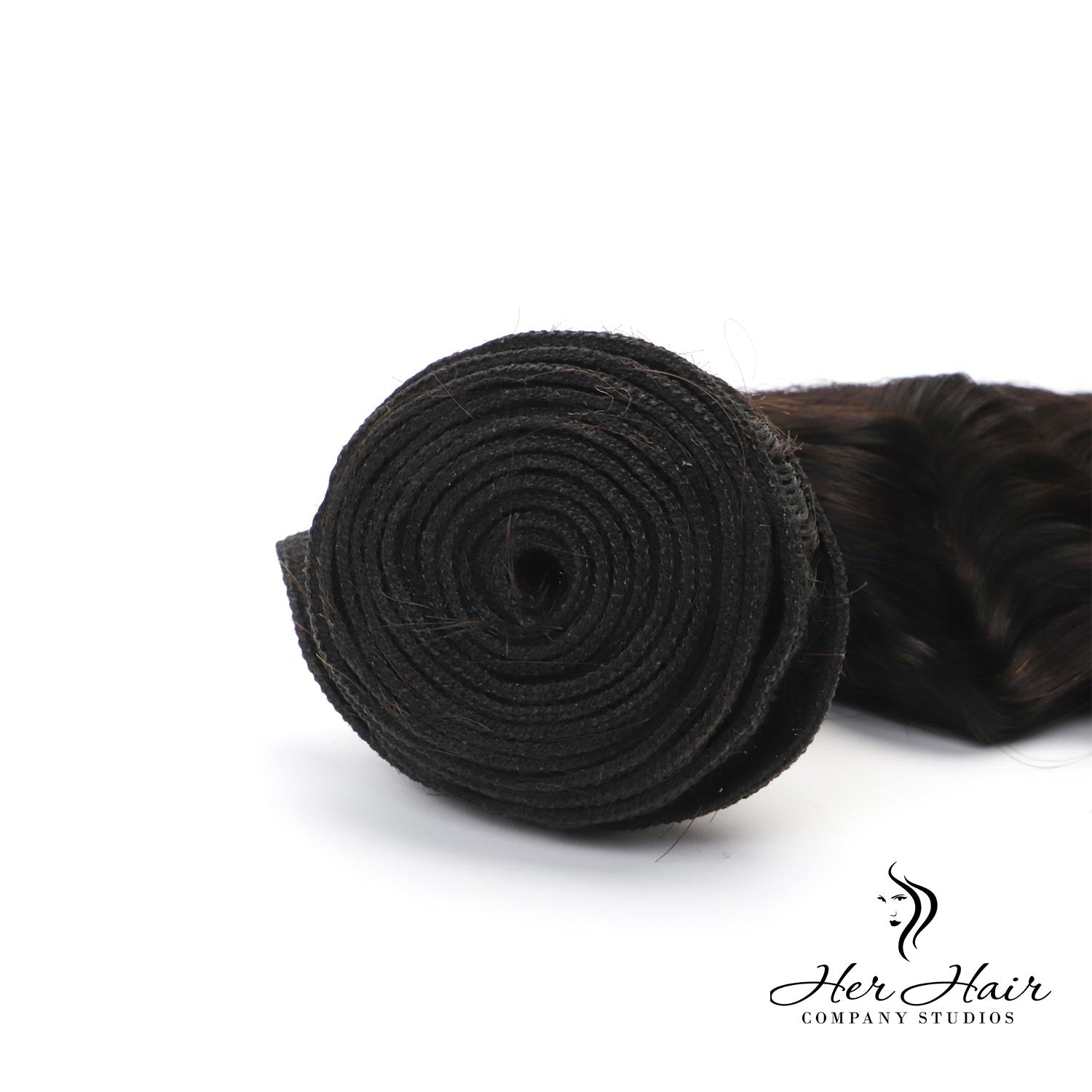 Brazilian Deep Wave hair bundles from Her Hair Company, showing three full bundles with wavy, deep wave texture.