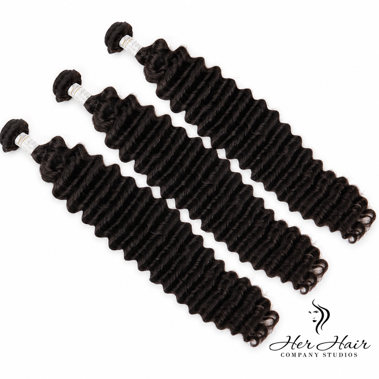Three bundles of Brazilian Deep Wave Hair from Her Hair Company, showing the textured, wavy hair bundles laid out together.